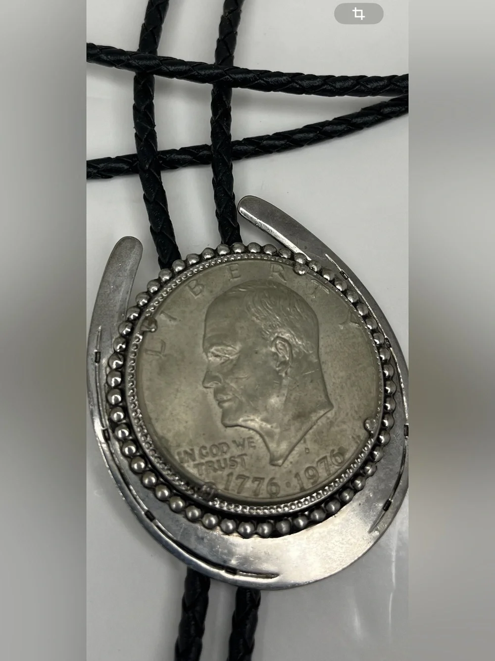 Black Braided Leather Bolo Tie with Silver Horseshoe and Coin Medallion
